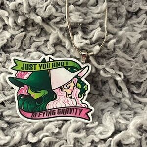 Silver Necklace with Defying Gravity Pendant